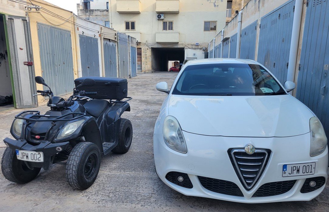 Paul Warren's Alfa Romeo carrying JPW 001 alongside his quad carrying JPW 002